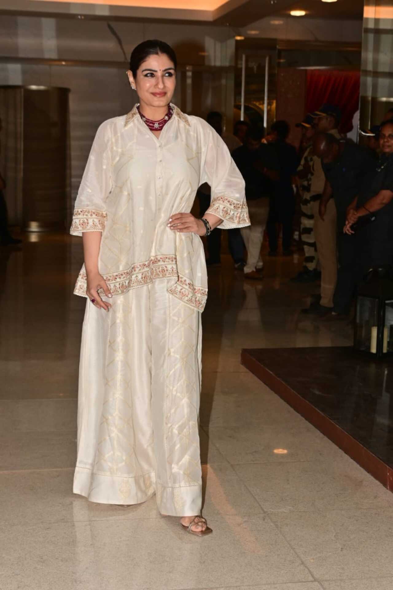 Raveena Tandon was a vision to behold in all-white outfit. She wore a white flowy top and paired it with palazzos. 